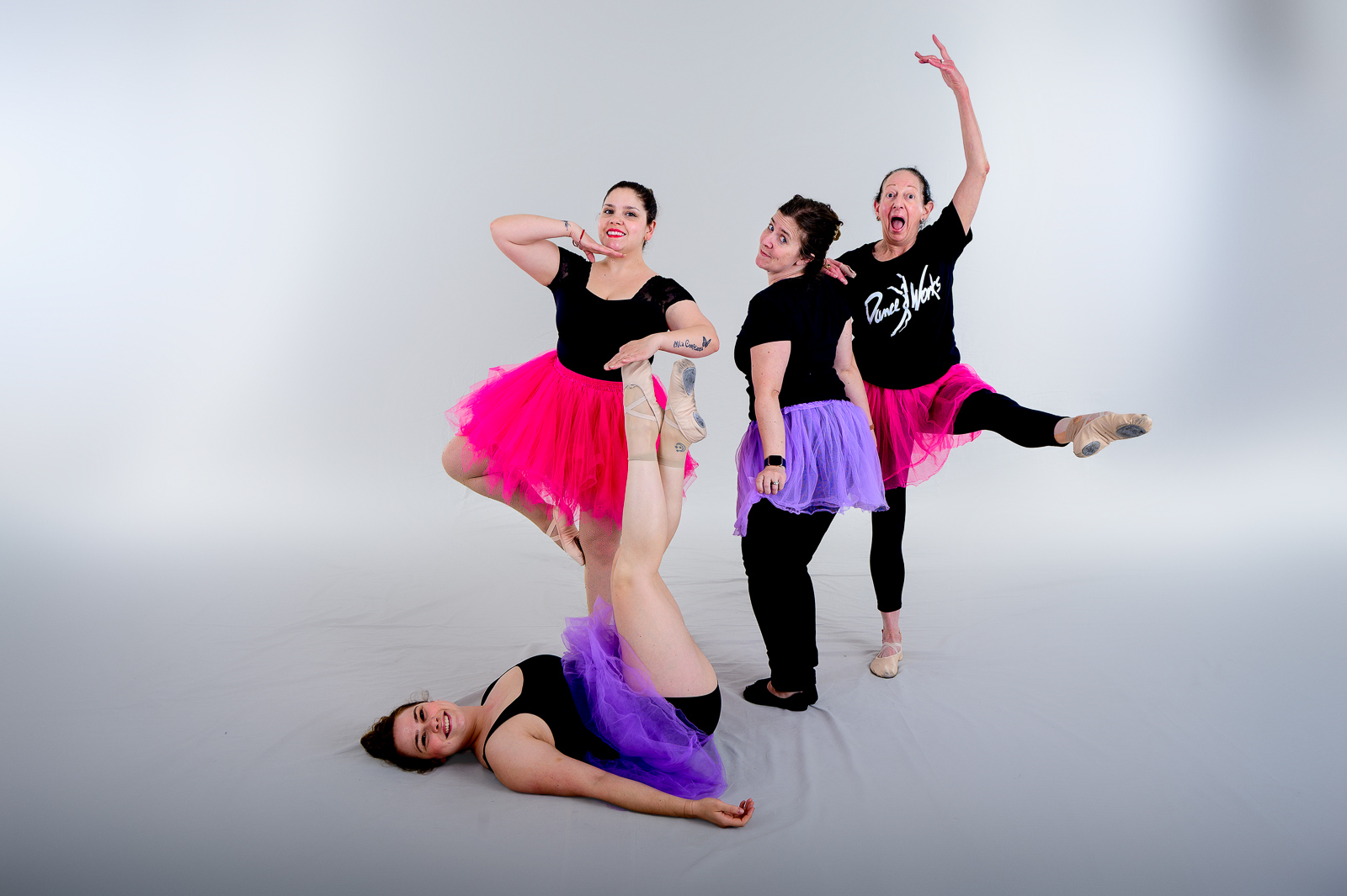 Adult ballet dancers having fun in class